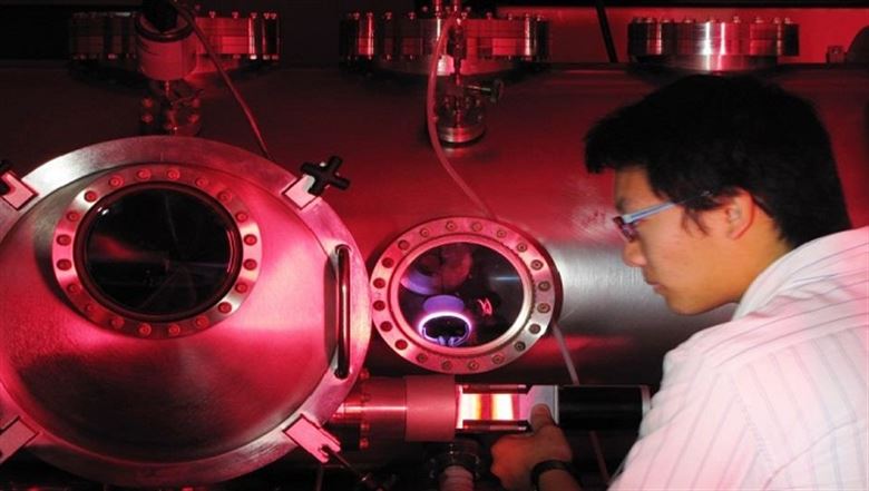 guy wearing lab coat with red colored objects